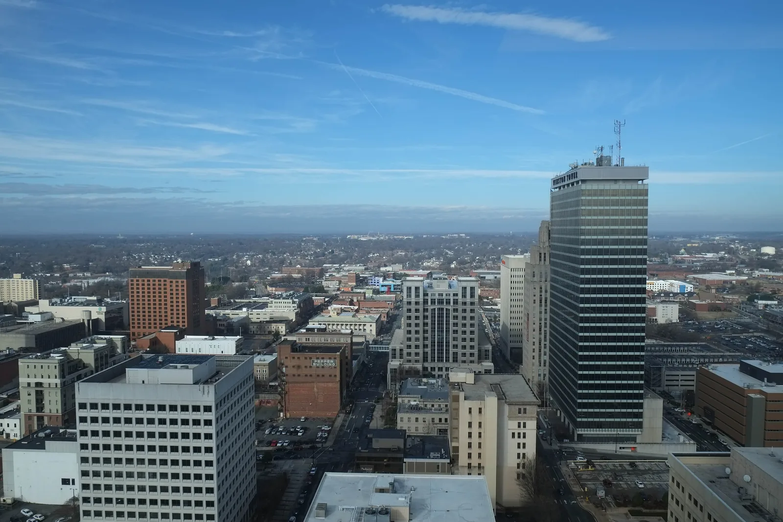 Downtown Winston-Salem's towers and the city beyond, seen from above.