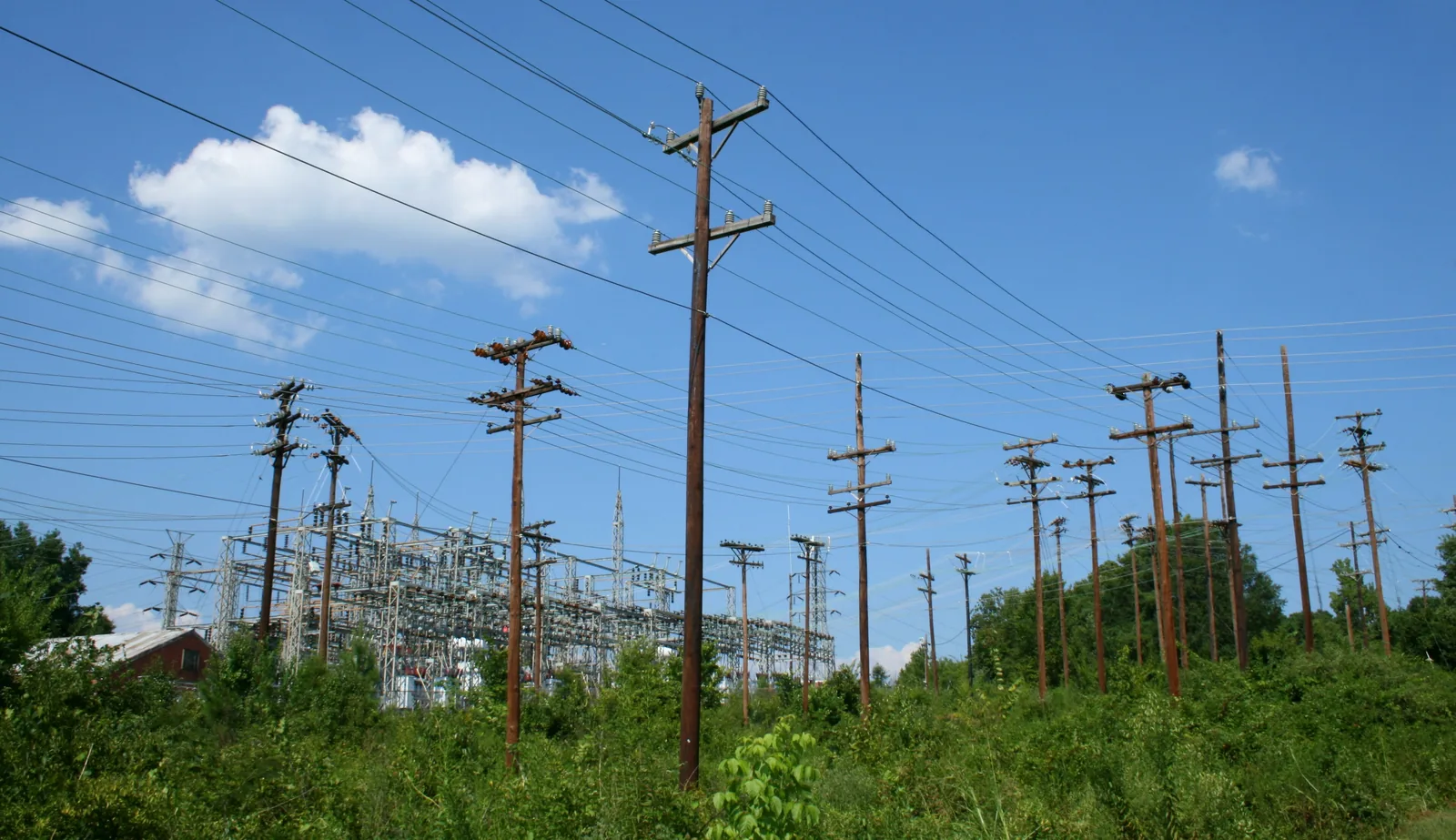 Utility poles lead to a Duke Energy substation in Durham, N.C.